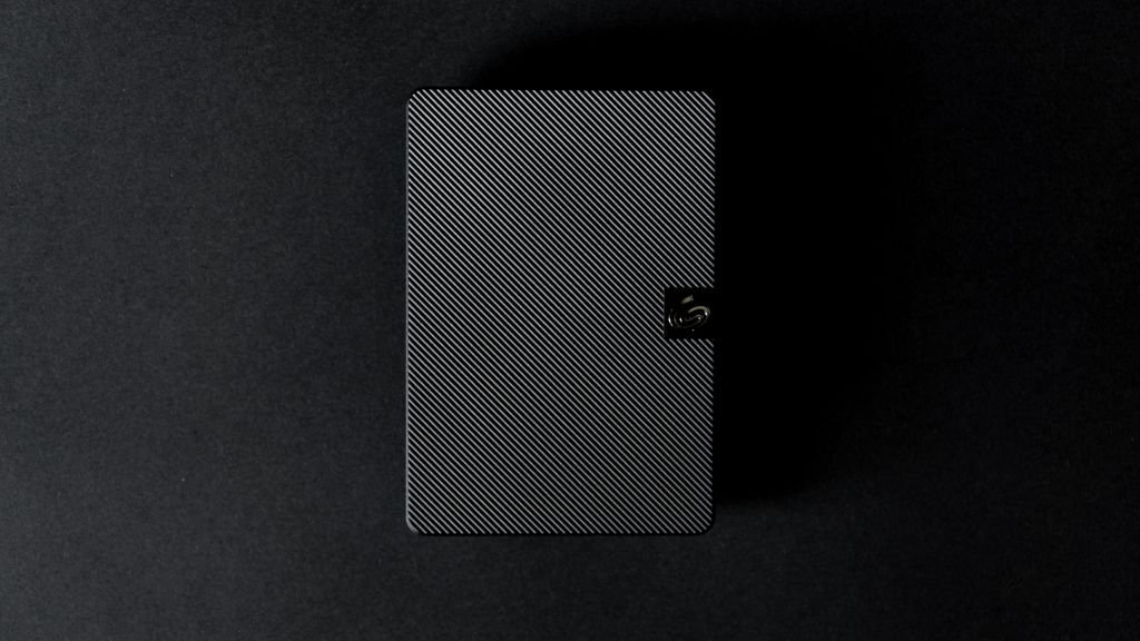 A sleek external hard disk used for storing and backing up data