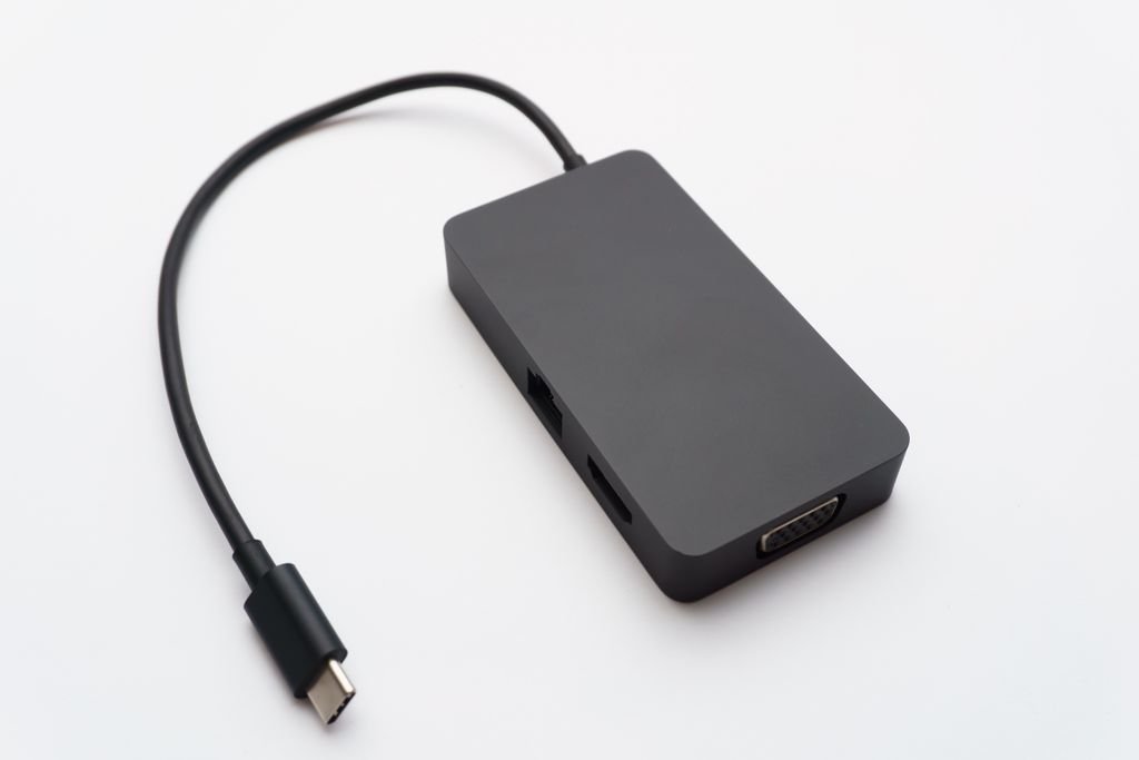 A USB-C hub with HDMI, USB and other ports and an attached cable
