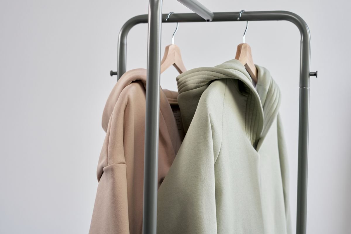 Hoodies hanging on a clothing rack
