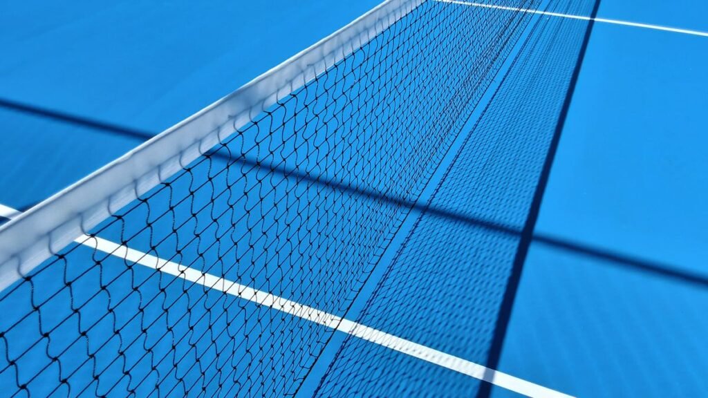 Blue hard tennis court and net
