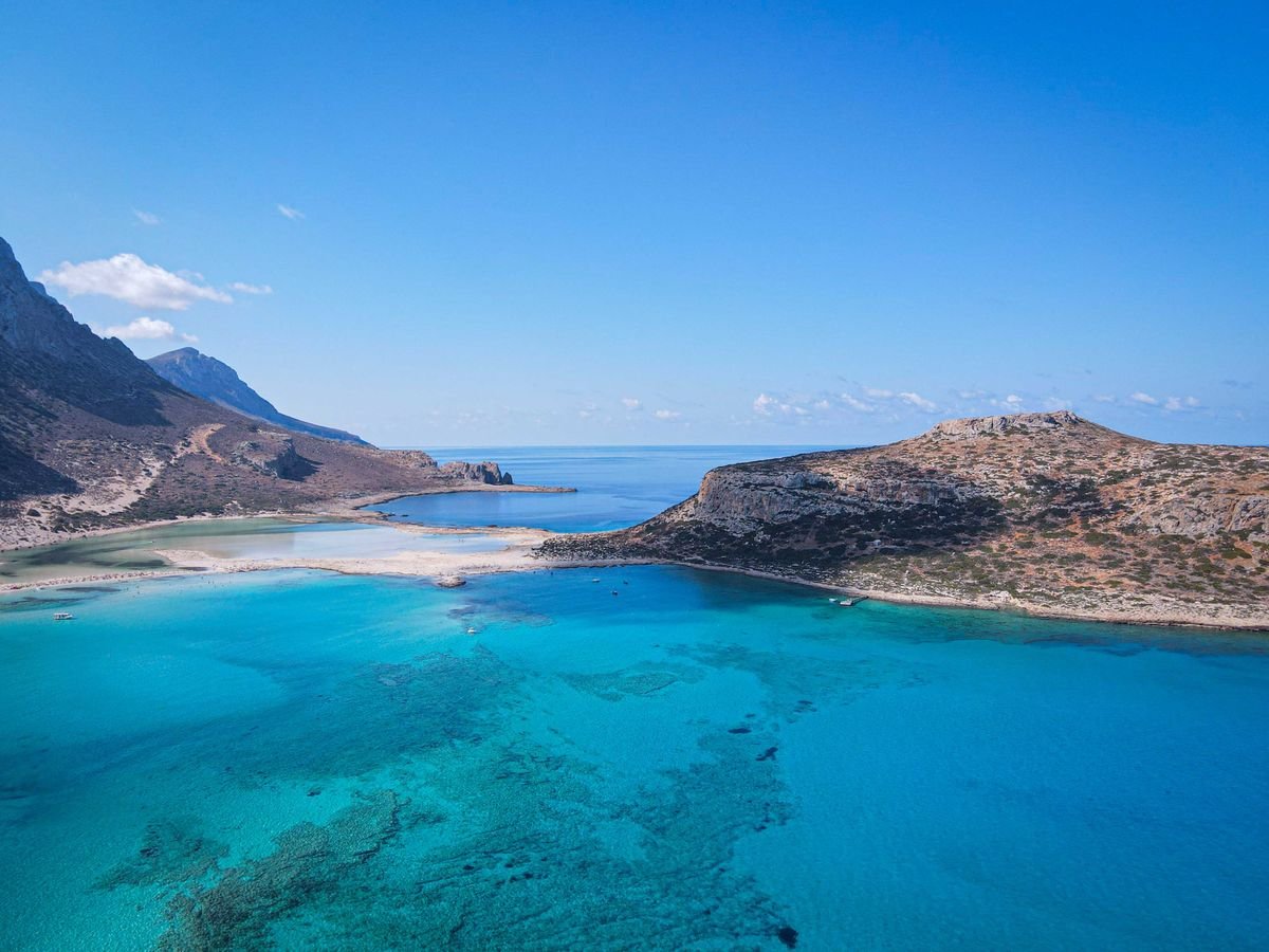 Turquoise lagoon and rocky headland on the Cretan coast